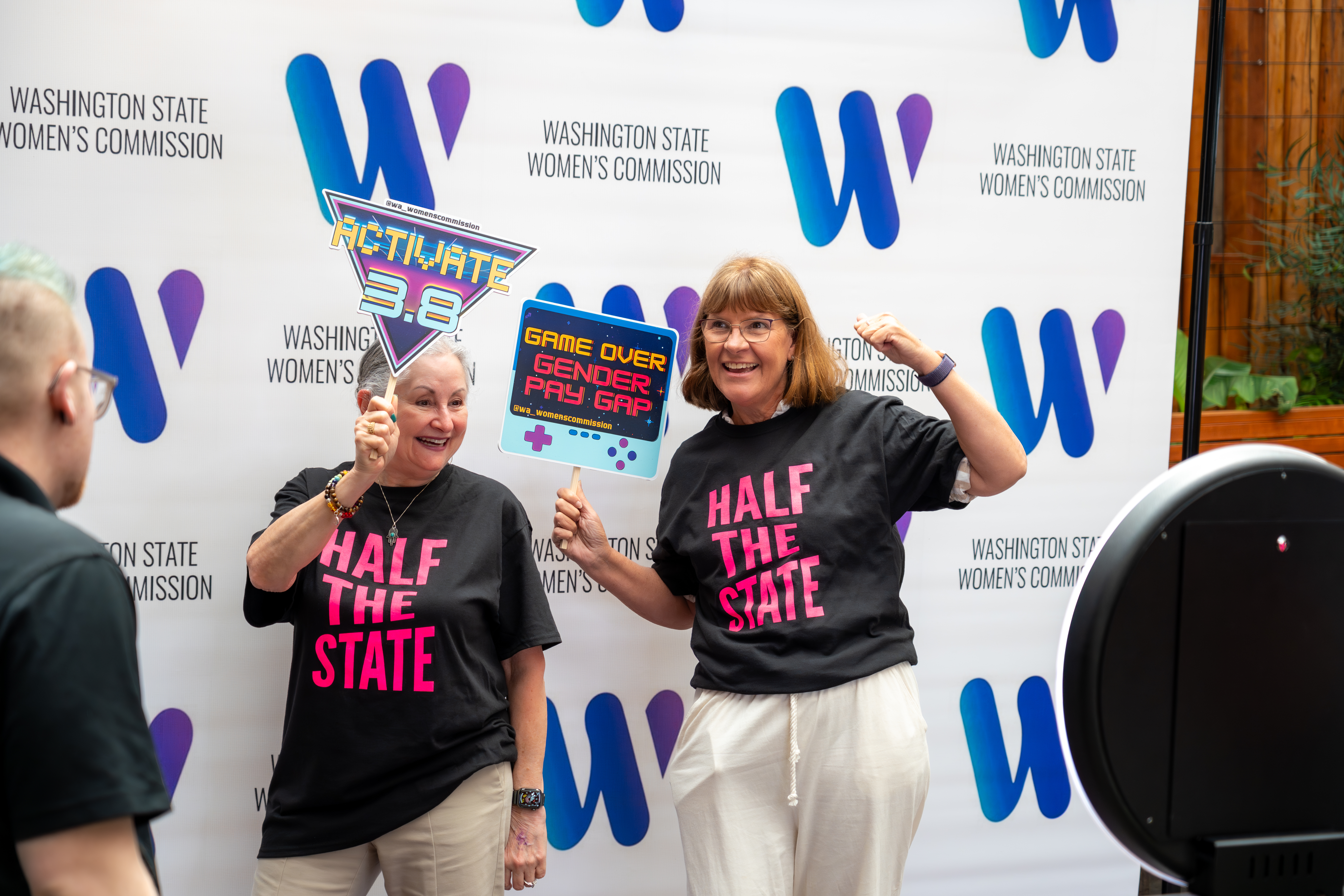 AAUW Volunteers take a photo at the photo booth