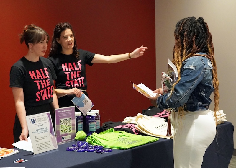 WSWC Staff works merch table