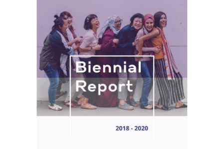 2018 – 2020 Biennial Report Cover Cover page of the Washington State Women's Commission “2018-2020 Biennial Report,” is bold white letters over a background image of a group of women laughing. The image is covered in a pink semi-transparent block.