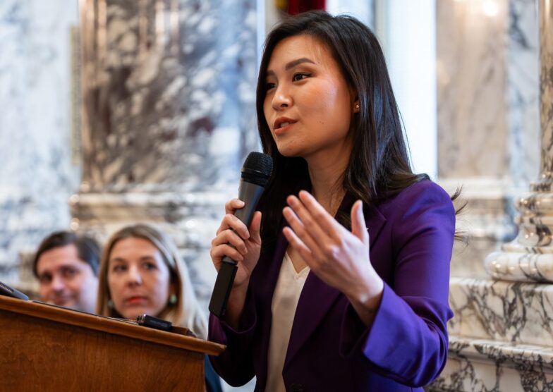 Photo 5, grace at podium Former Executive Director Grace Yoo speaks at podium.